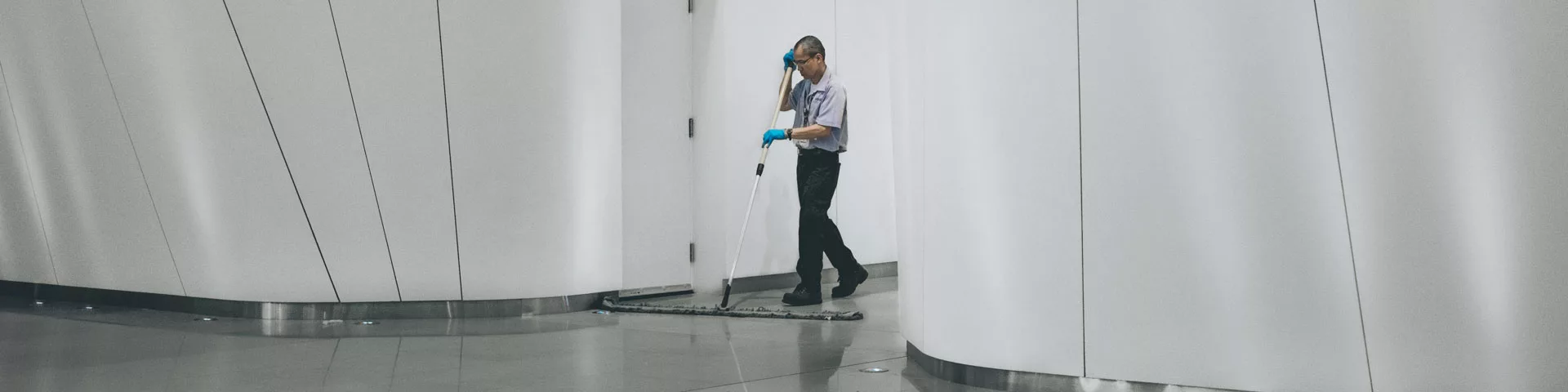 Janitor cleaning a commercial building